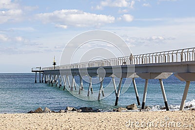 Bridge over mediterranean sea, pont del petroli, Badalona, Catalonia, Spain. Editorial Stock Photo