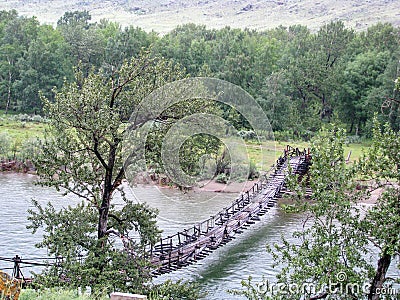 Bridge over the river in the mountainous Altai, Russia Stock Photo