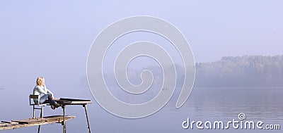 bridge river woman wooden sunrise fog travel meditation reflection thought Stock Photo