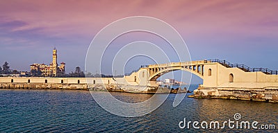 Bridge in the sea at Montazah park with the Royal palace in the far distance with calm sea at sunrise time, Alexandria, Egypt Editorial Stock Photo