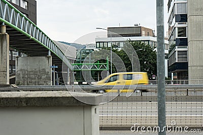 Bridge on street with cars passing by Stock Photo