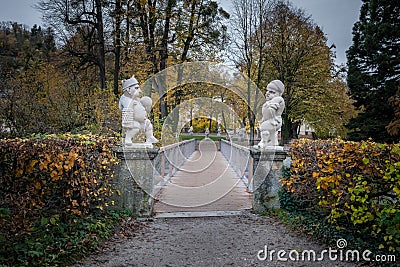 Bridge to Dwarf Garden Zwergerlgarten with Pallone Player Dwarfs - 17th century statues - Salzburg, Austria Stock Photo