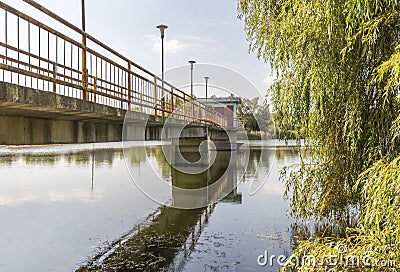 Bridge leading to the middle of the lake Stock Photo