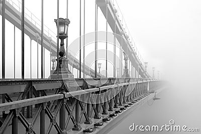 Bridge in a foggy morning Stock Photo