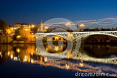 Bridge triana sevilla andalucia spain at night with lights Stock Photo