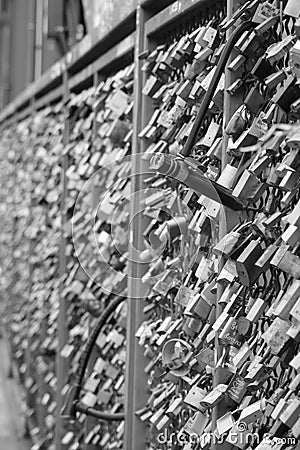 bridge withsome multicolor safety locks love in black and white Editorial Stock Photo