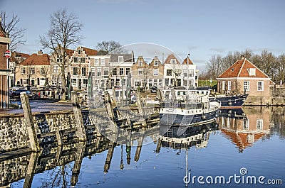 Canal boat and houses on a sunny day Editorial Stock Photo