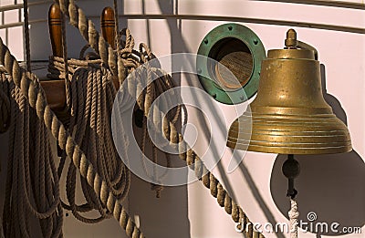 Vintage sailboat`s bell, porthole and rope lines Editorial Stock Photo