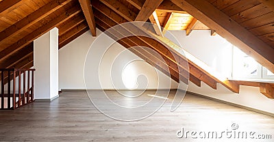 Bright attic with wooden beams and parquet Stock Photo