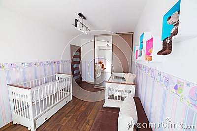 Bright baby room with white cradles Stock Photo