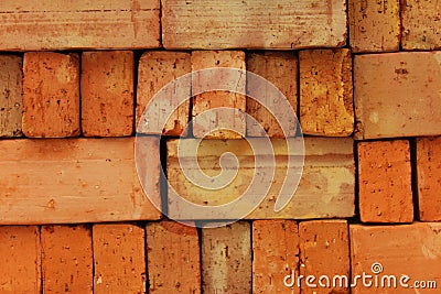 Background of red tempered building brick. Stock Photo