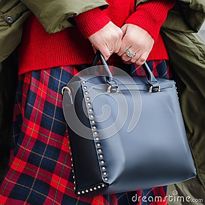 A bright bag in women`s hands. Leather bag. Stock Photo