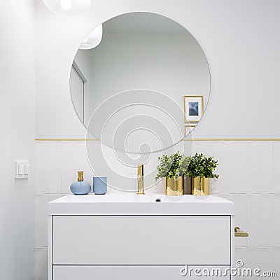 Bright bathroom with round mirror Stock Photo