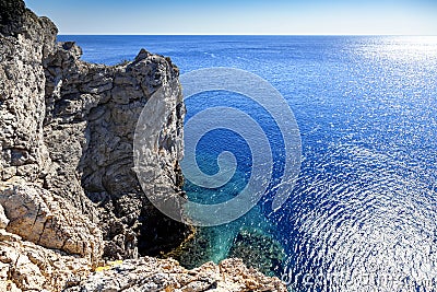 bright beautiful landscape with blue sea and harsh rocks Stock Photo