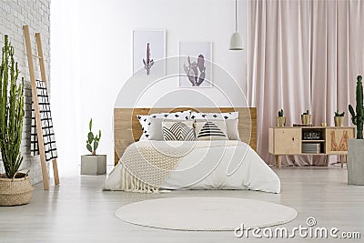 Bright bedroom with cactus motif Stock Photo