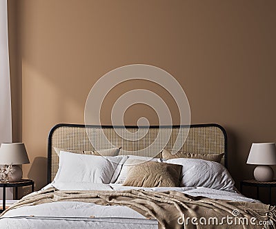 Bright bedroom mockup, rattan wooden bed in a beige background, wall mock up in a neutral colors room interior Stock Photo