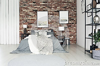 Simple bedroom with brick wall Stock Photo