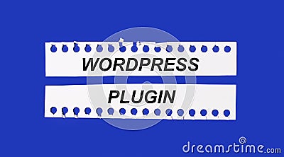 On a bright blue background, two white strips of paper with the text WORDPRESS PLUGIN Stock Photo