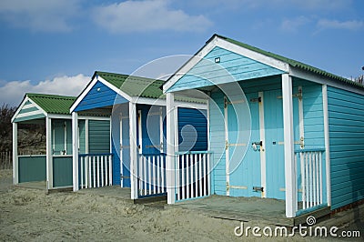 Bright blue beach huts Stock Photo