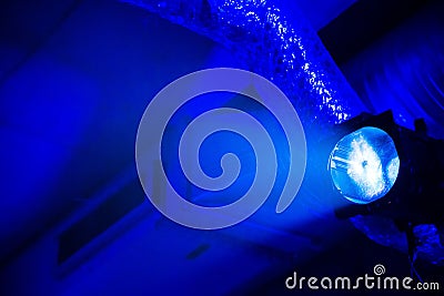 Bright blue light at the underground parking garage with ventilation pipes at background Stock Photo