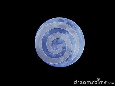 Bright Blue Moon Isolated on a Natural Black Night Sky Stock Photo