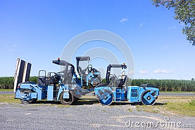 Bright blue road maintenance machinery Editorial Stock Photo