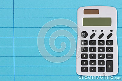 Bright blue ruled line notebook paper with a calculator Stock Photo