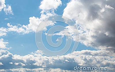 Bright blue sky with fluffy white clouds on a sunny day. Stock Photo