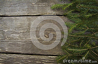 Bright christmas background frame with a copy space with fir branches with a wooden table Stock Photo
