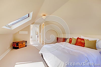 Bright clean attic bedroom in the small home. Stock Photo