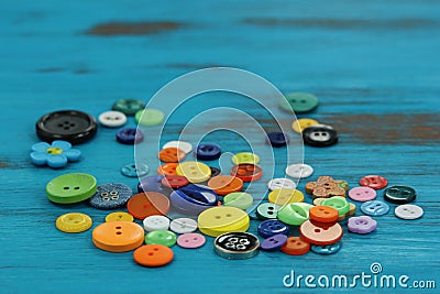 Bright colored buttons on a rustic blue wooden background Stock Photo
