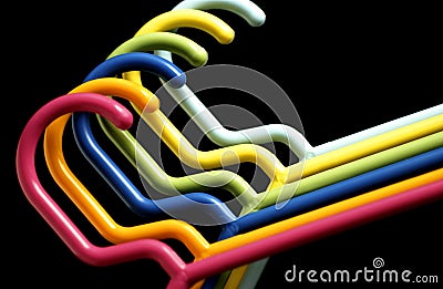 Bright colored plastic hangers Stock Photo