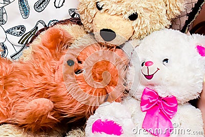 Bright colored soft toys in a messy situation Stock Photo