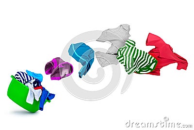 Bright colorful clothes flying out from wash bowl on white Stock Photo