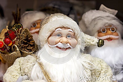 Bright colorful Santa Claus doll in costume with long white beard. Christmas and New Year holidays traditional decorations concept Stock Photo