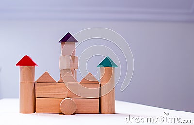 Bright colorful wooden blocks toy. Bricks children building tower, castle, house Stock Photo