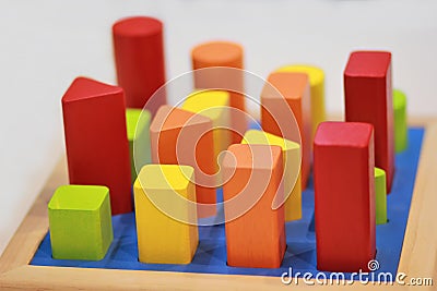 Bright colorful wooden children toy sorter on a shelf in the shop. Stock Photo