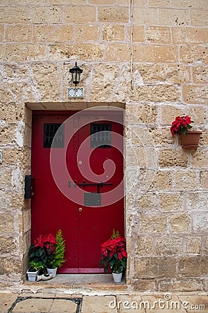 Bright colourful door way in a stone building Stock Photo