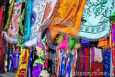 Bright colourful multicolored Arabian, Turkish, oriental traditional babushka shawls, rugs Editorial Stock Photo