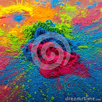 Bright colours on sawed wood for Indian holi festival. Colorful gulal powder colors for Happy Holi with copy space Stock Photo