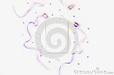 Bright composition with silk ribbons, sequins and crystal on a white background. Space for a greeting text. Photos for Stock Photo