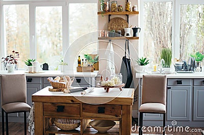 Bright cozy kitchen with windows, kitchen tools Stock Photo