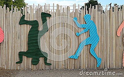 Bright dancing silhouettes on the temporary fence near Next Gallery on Colfax Avenue in Denver Editorial Stock Photo