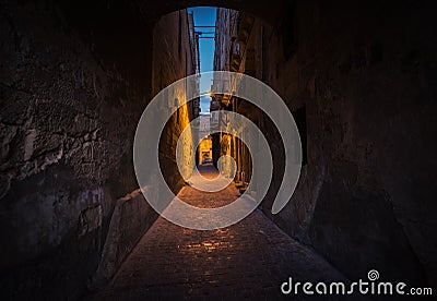 Bright and dark alleys of Valletta. The path to light. Malta. Stock Photo