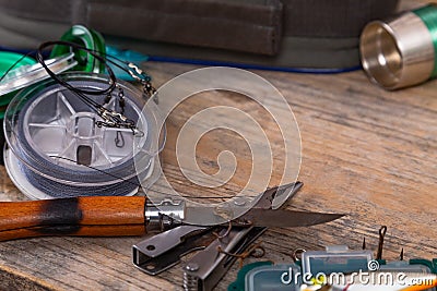 Bright different fishing tackles on wooden background Stock Photo