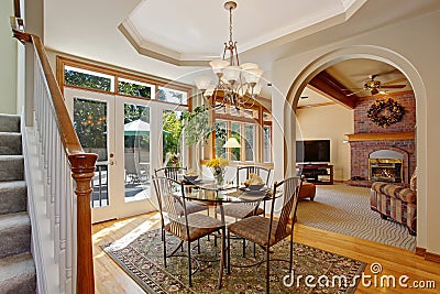 Bright dining area with walkout patio in luxury house Stock Photo