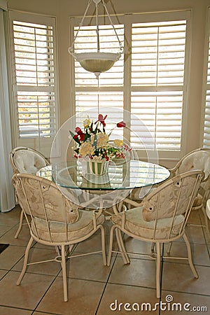 Bright dining room with shutters Stock Photo