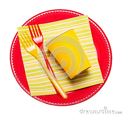 Bright disposable plates, paper cups, plastic forks napkin isolated. Stock Photo