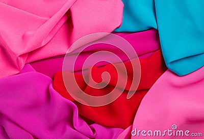 Bright draped background of multi-colored fabric Stock Photo