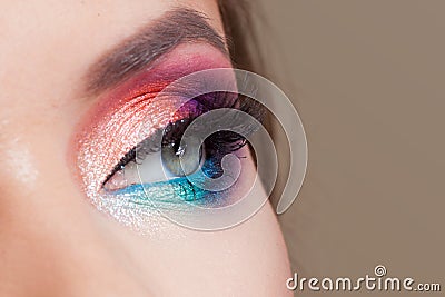 Bright eye makeup. Pink and blue color, colored eyeshadow. Stock Photo